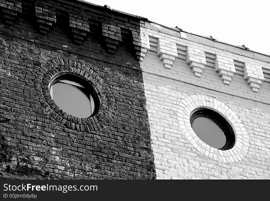 Circular windows on old brick building downtown