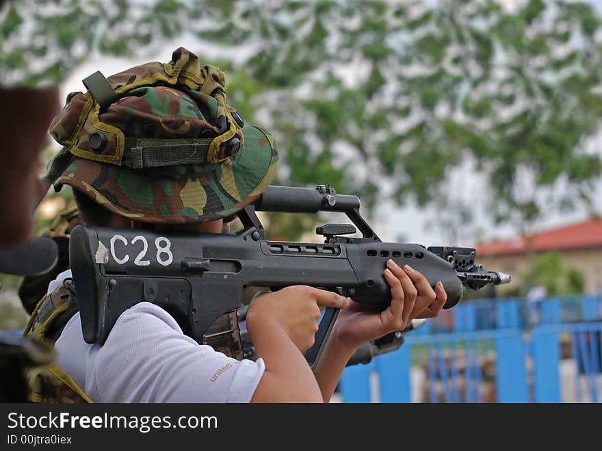 Man Testing The Machine Gun