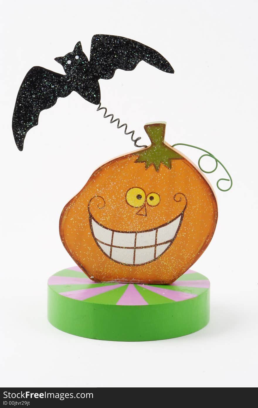 Smiling pumpkin with a black bat. Smiling pumpkin with a black bat