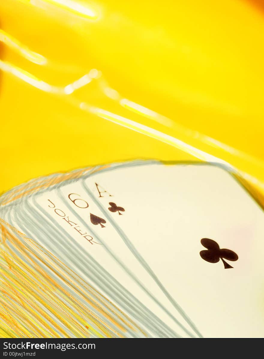 Playing cards on a yellow background