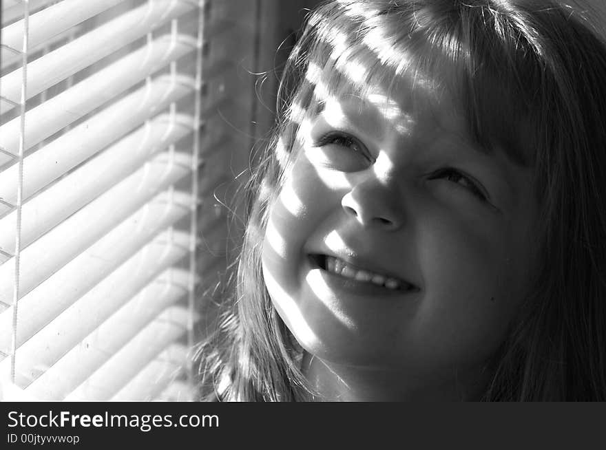 A girl in a striped light