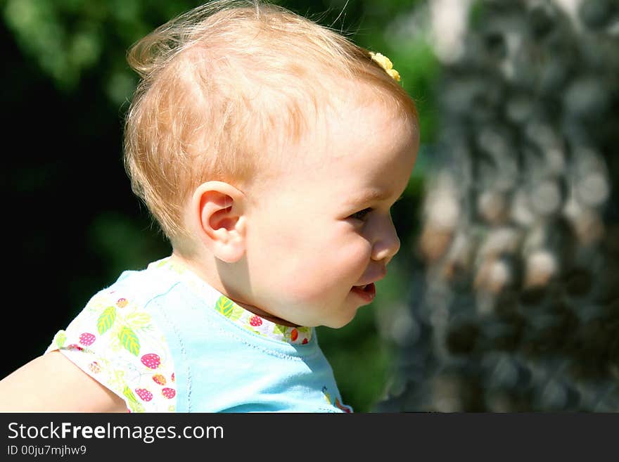 Little girl playing outside and smiling. Little girl playing outside and smiling