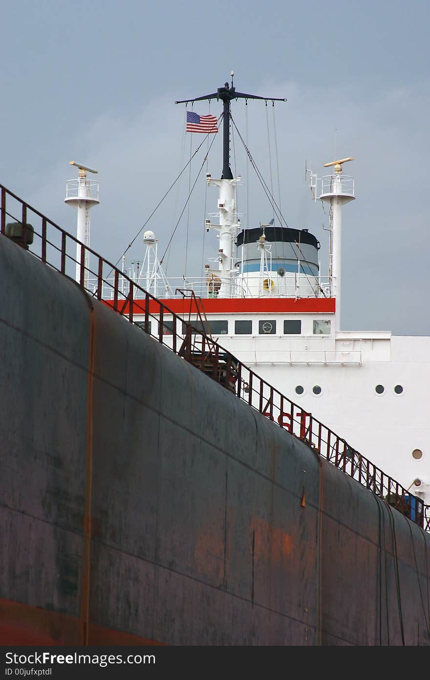 Vertical closeup abstract style image of a large cargo ship. Vertical closeup abstract style image of a large cargo ship.