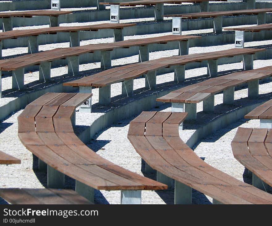 Empty grandstand by the lake in summer