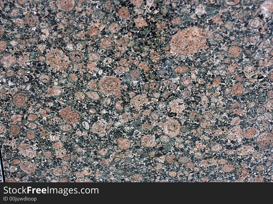 Red marble is photographed by close up. Red marble is photographed by close up