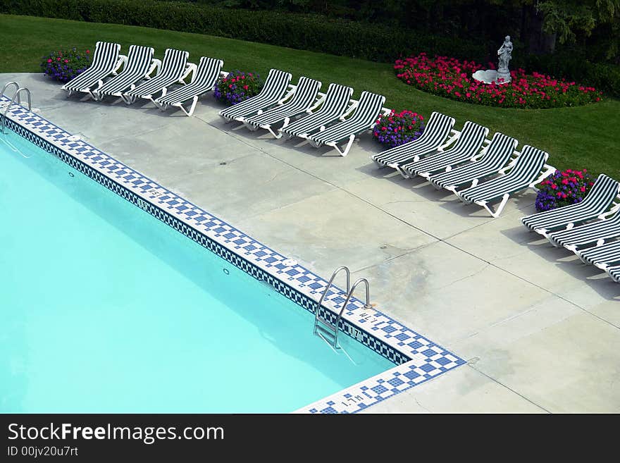 Outdoor pool and lounge chairs at a executive hotel in Banff, Canada. Outdoor pool and lounge chairs at a executive hotel in Banff, Canada