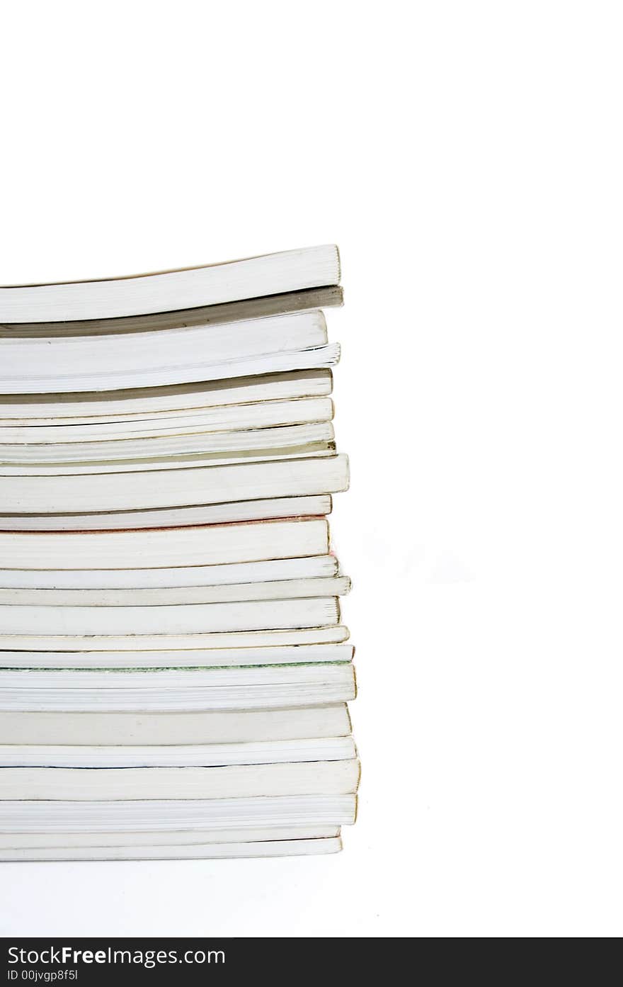 Pile of books stacked - isolated over white. Pile of books stacked - isolated over white