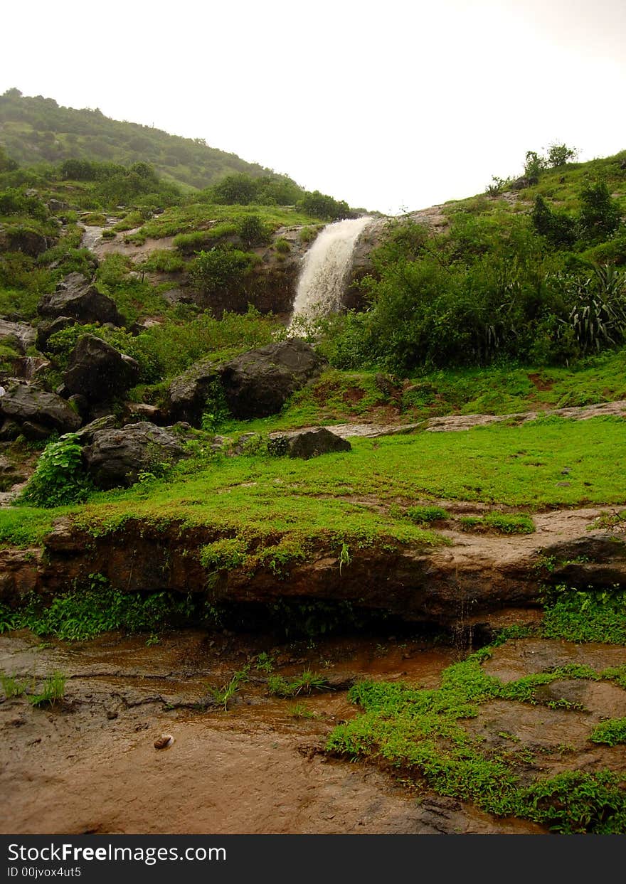 A small and seasonal waterfall from mountain. A small and seasonal waterfall from mountain.