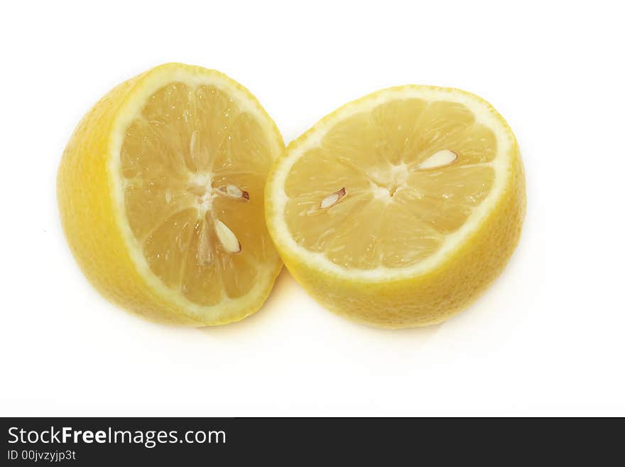 A yellow lemon sliced in the midle. A yellow lemon sliced in the midle