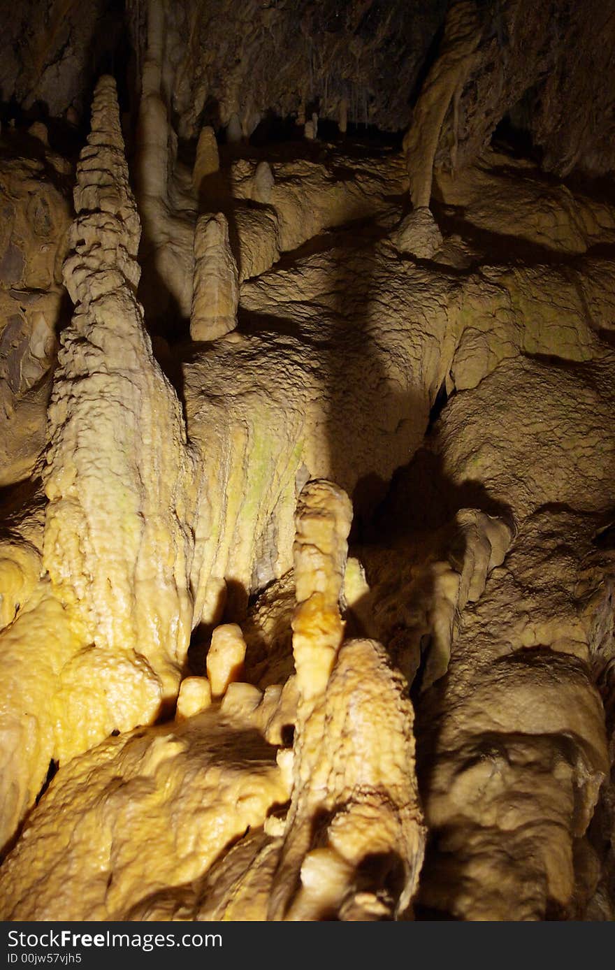 Stalagmites in the underground cavern grotto. Valorbe, Switzerland, EU. Stalagmites in the underground cavern grotto. Valorbe, Switzerland, EU.