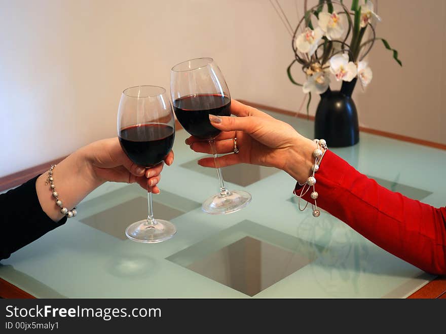 Girlfriends celebrate with red wine. Girlfriends celebrate with red wine