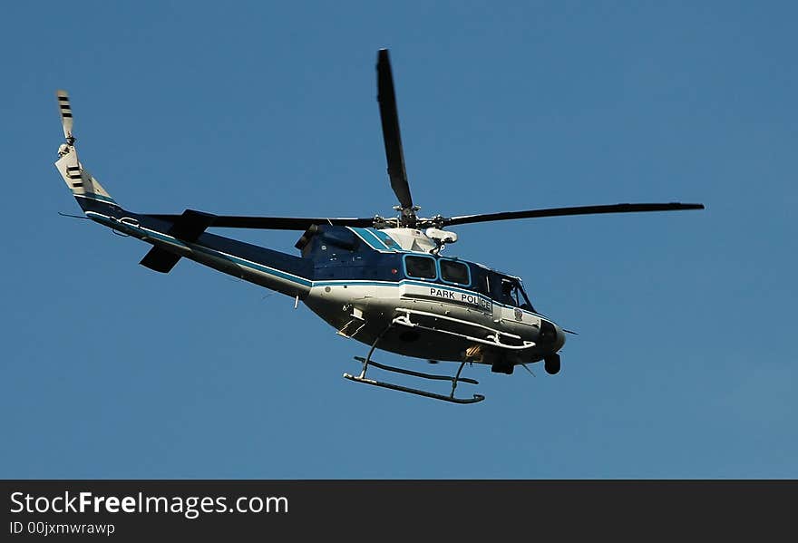 Park Police Helicopter flying over the Potomac river for a rescue mission