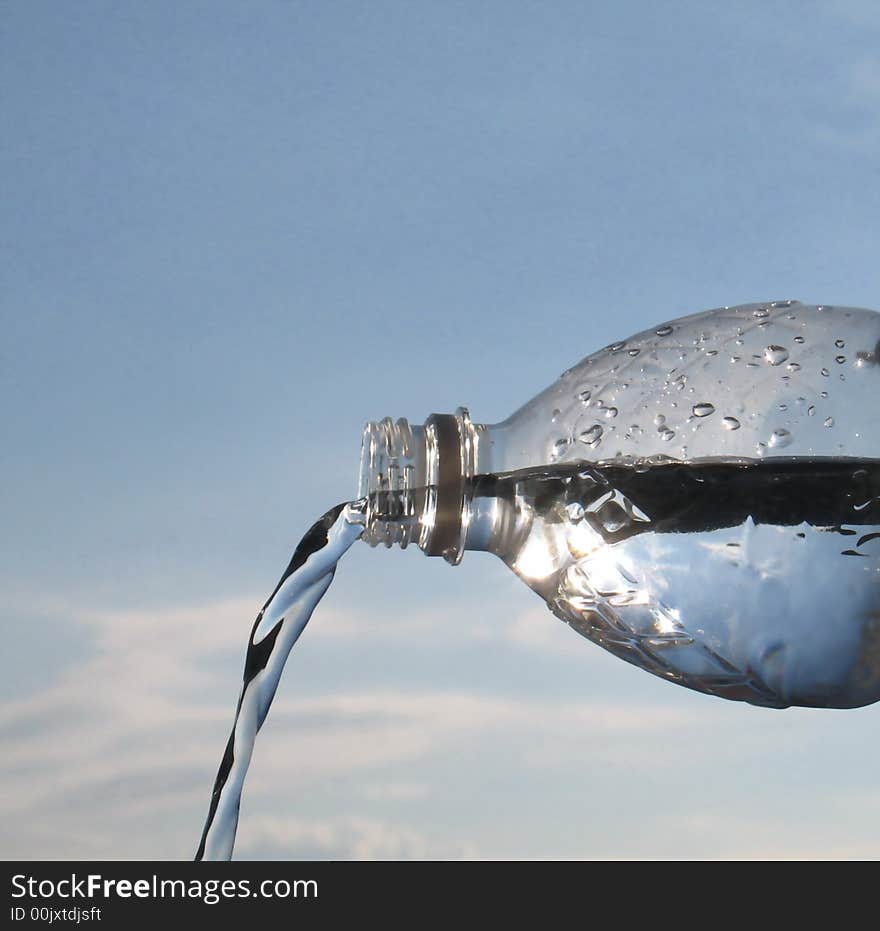 Pouring water from a bottle