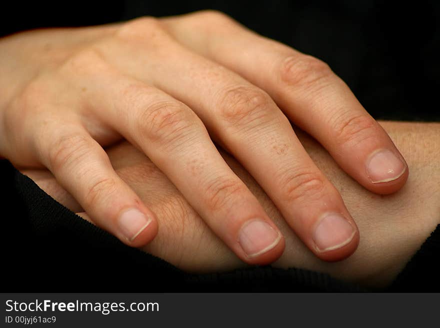 A photo of two woman's hands relaxed. A photo of two woman's hands relaxed