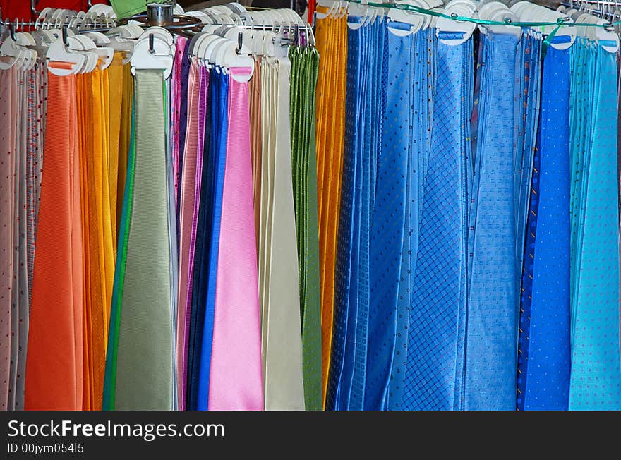 Row of colorful neck ties