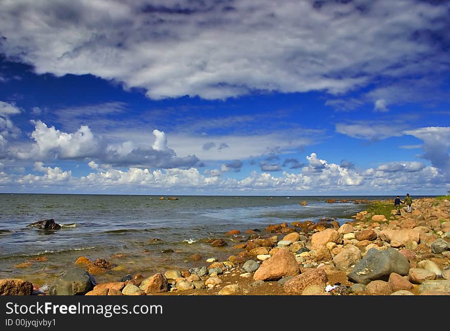 Landscape with blue sky, clouds, stones and sea. Landscape with blue sky, clouds, stones and sea