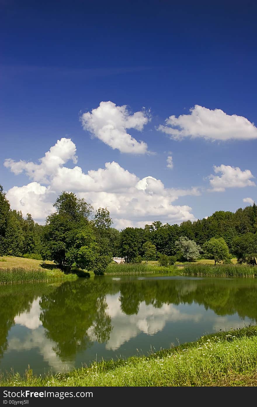 Landscape with blue sky, clouds, forest and lake. Landscape with blue sky, clouds, forest and lake