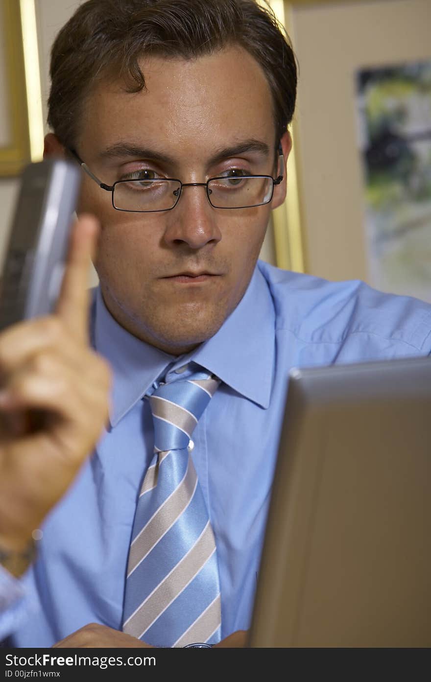 A young business man is looking serious. A young business man is looking serious