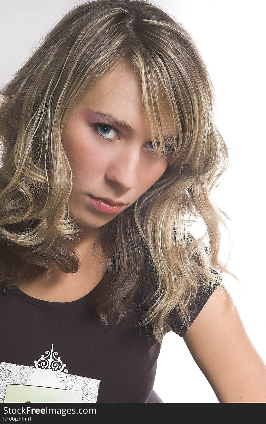 Portrait of the beautiful girl on a white background