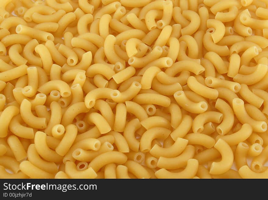 Yellow uncooked noodles -background, texture