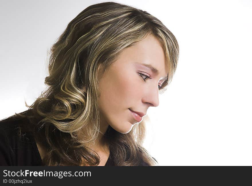 Portrait of the beautiful girl on a white background