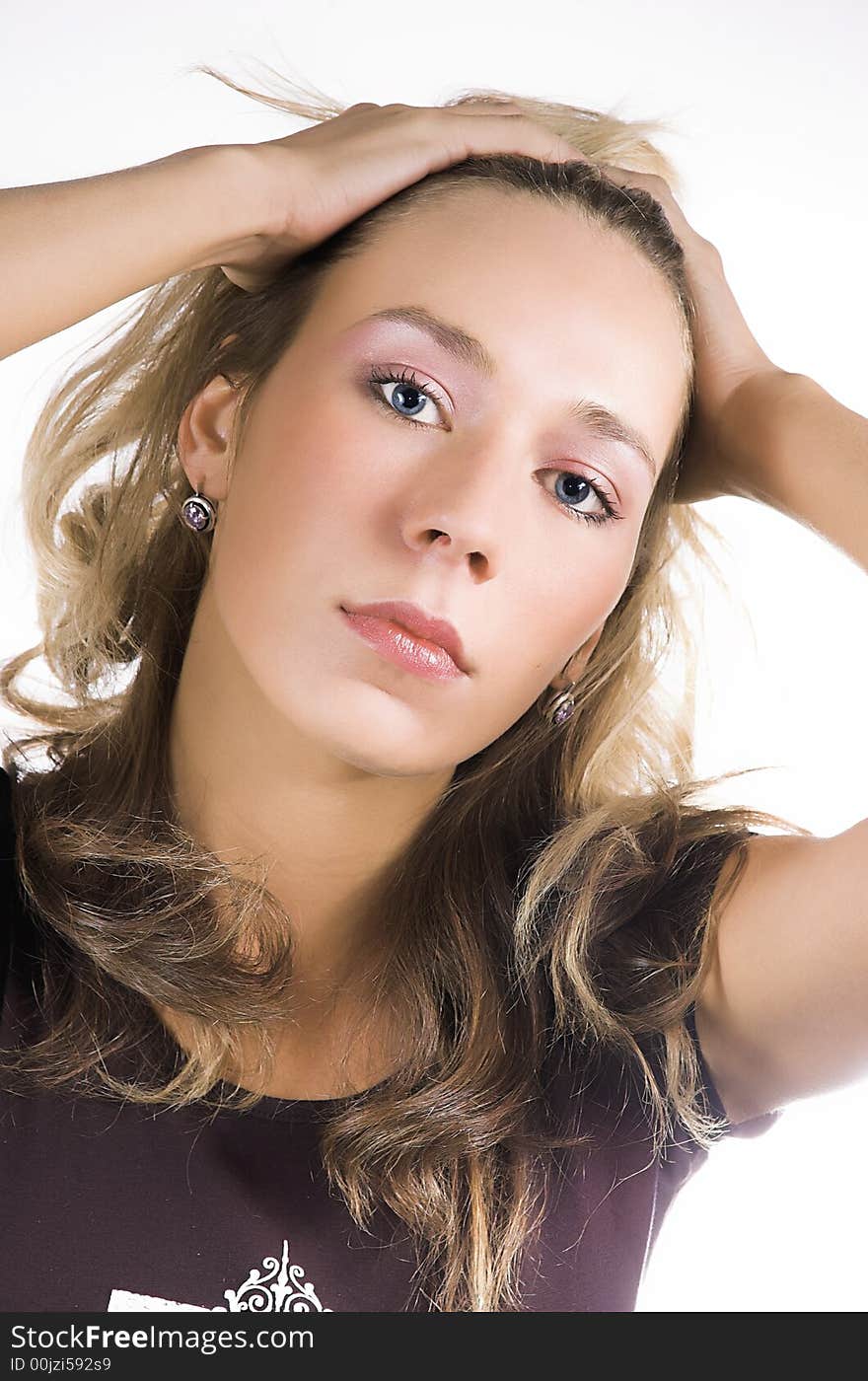 Portrait of the beautiful girl on a white background