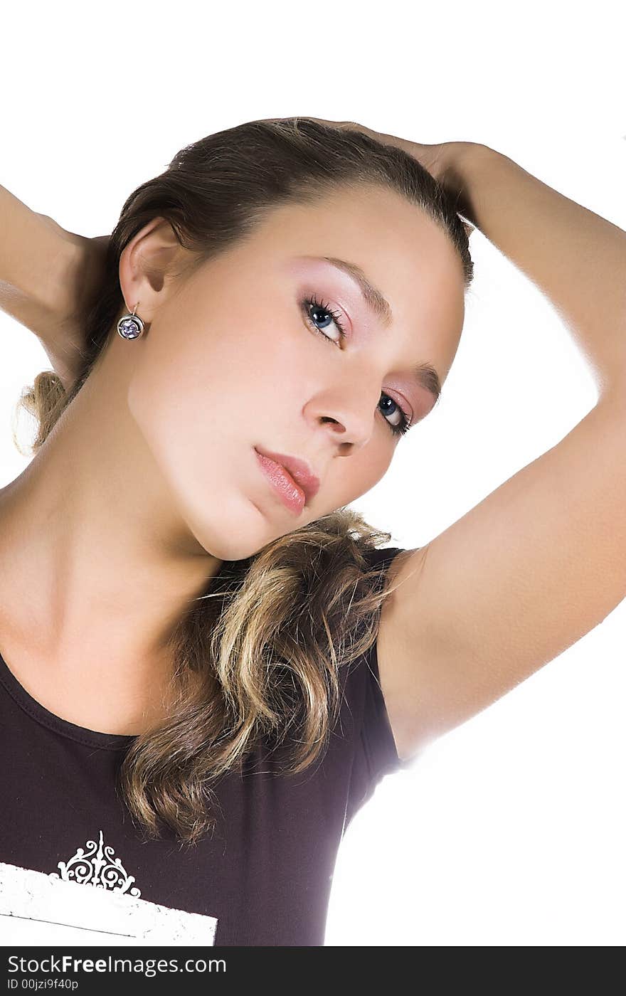 Portrait of the beautiful girl on a white background