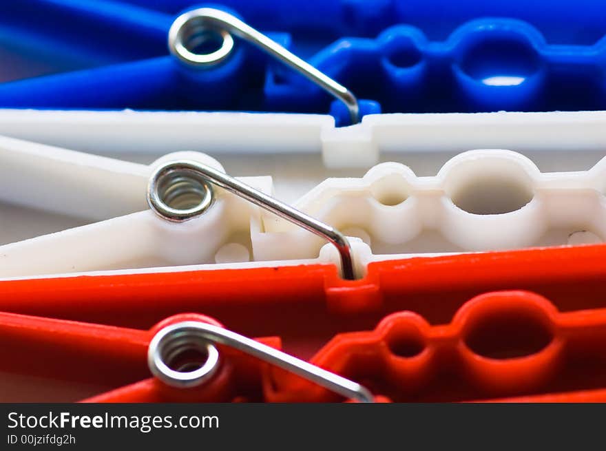 Close up of red white and blue clothes pegs