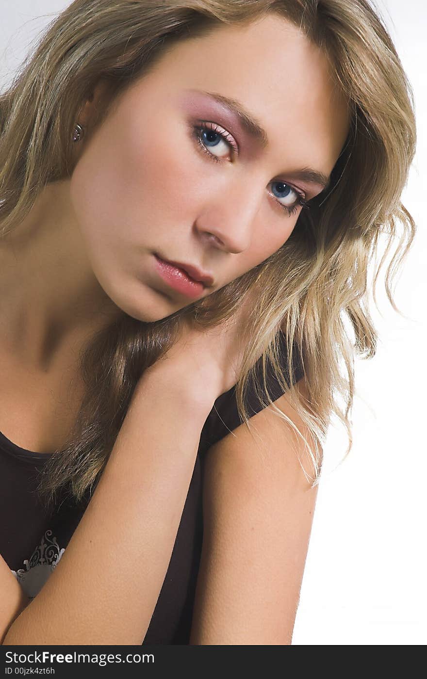 Portrait of the beautiful girl on a white background