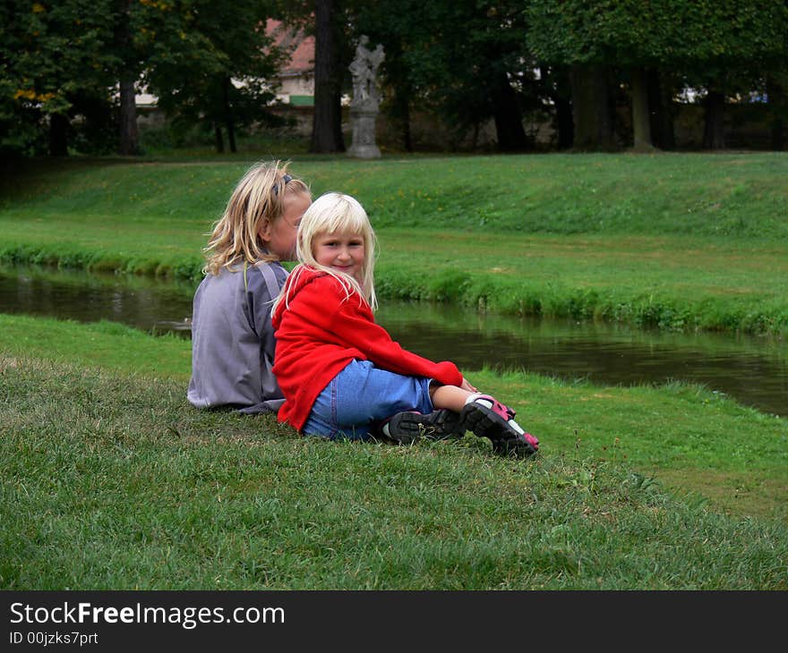 Children sitting and relaxing in the park. Children sitting and relaxing in the park