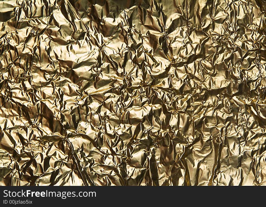 Very wrinkled golden metal background. Very wrinkled golden metal background