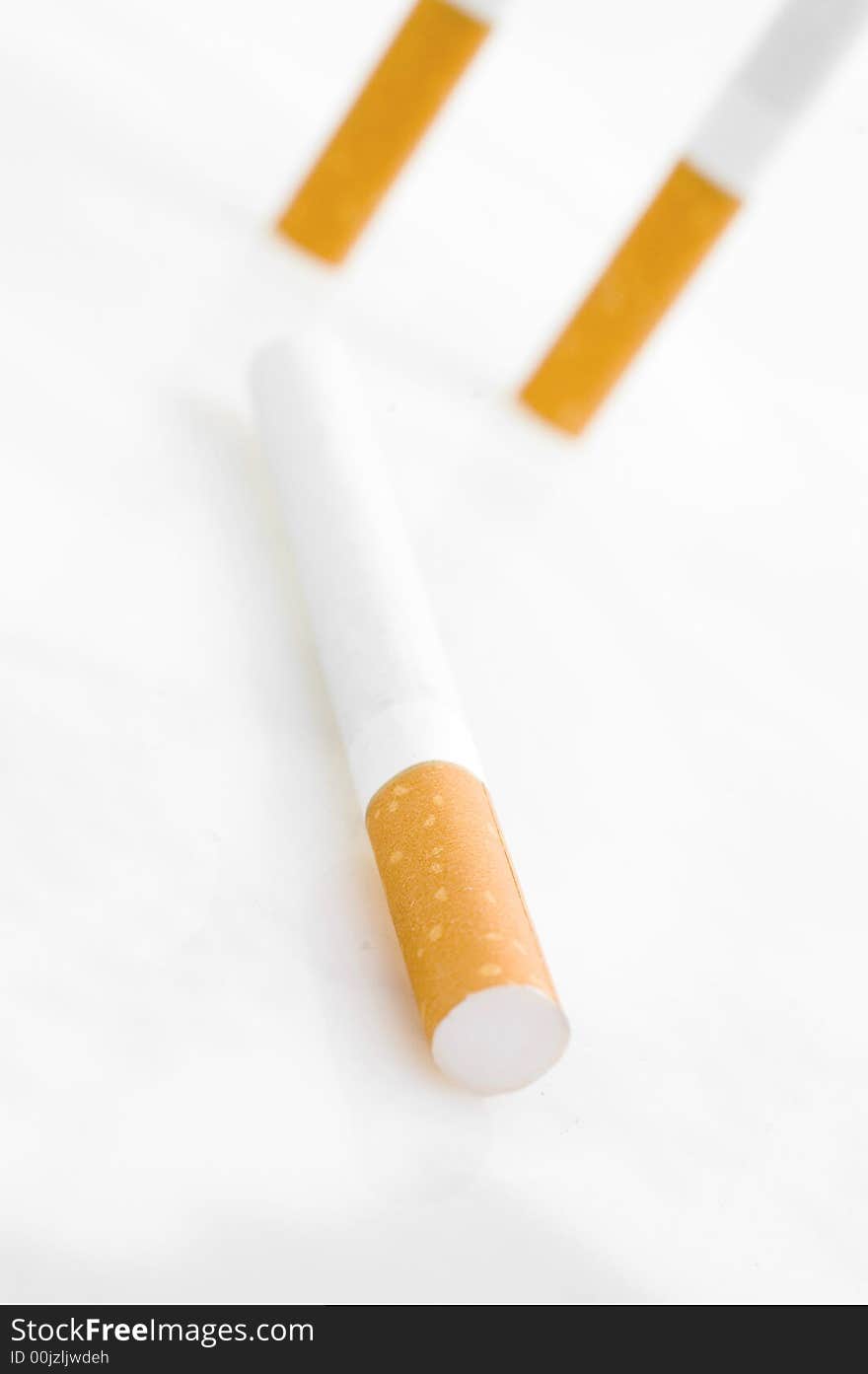 Three cigarettes on white background. Three cigarettes on white background.