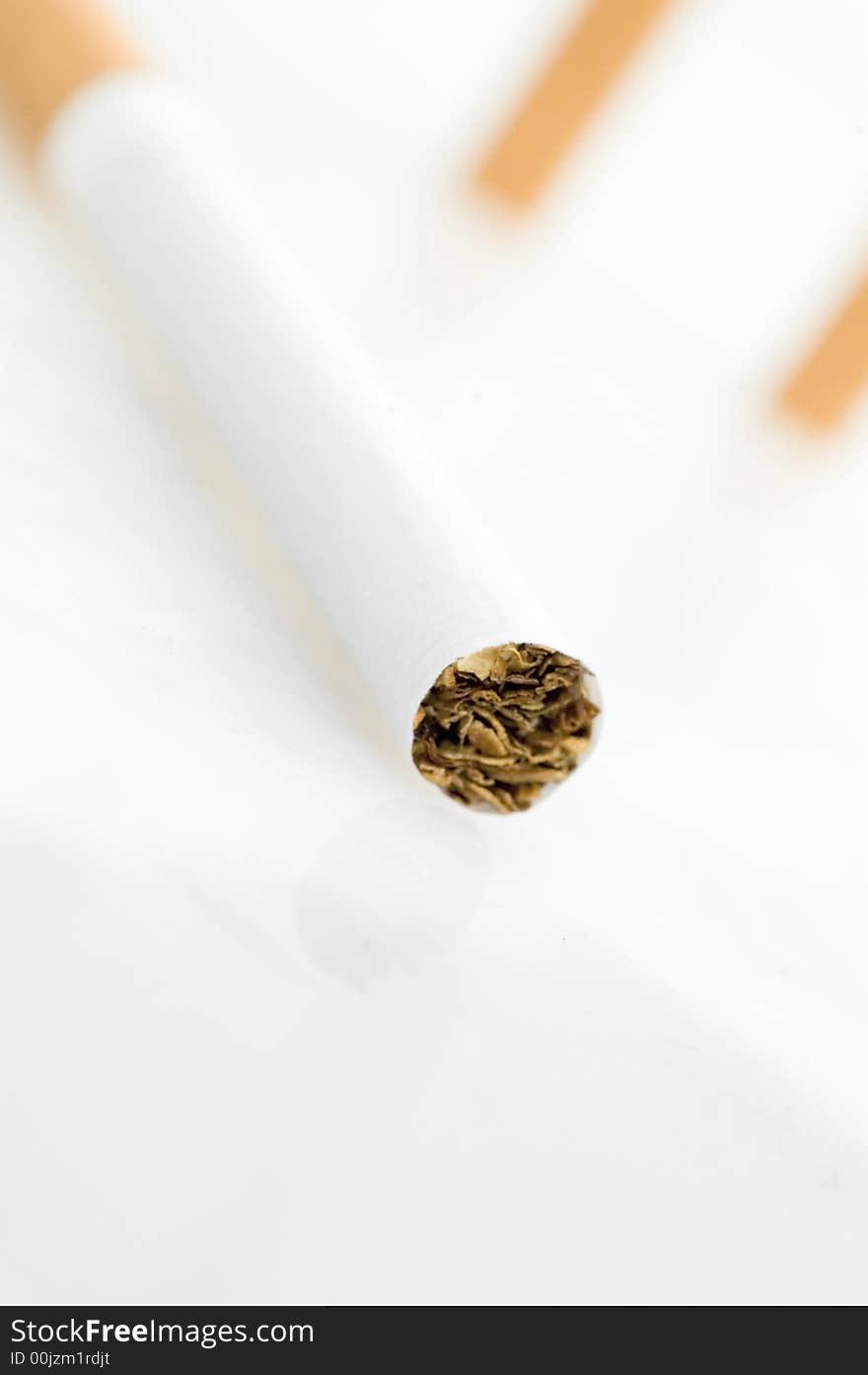 Three cigarets.on white background.