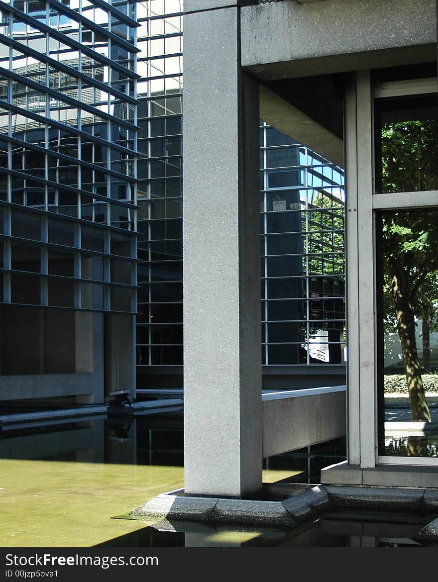 Corner of the modern building with a fountain. Corner of the modern building with a fountain