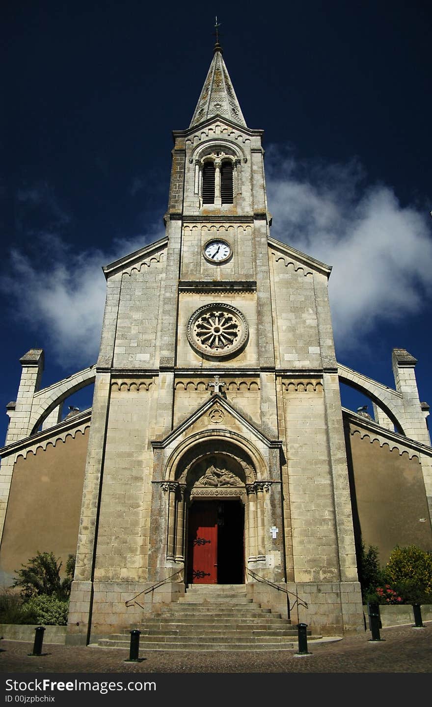 A front side of a gothic church in france