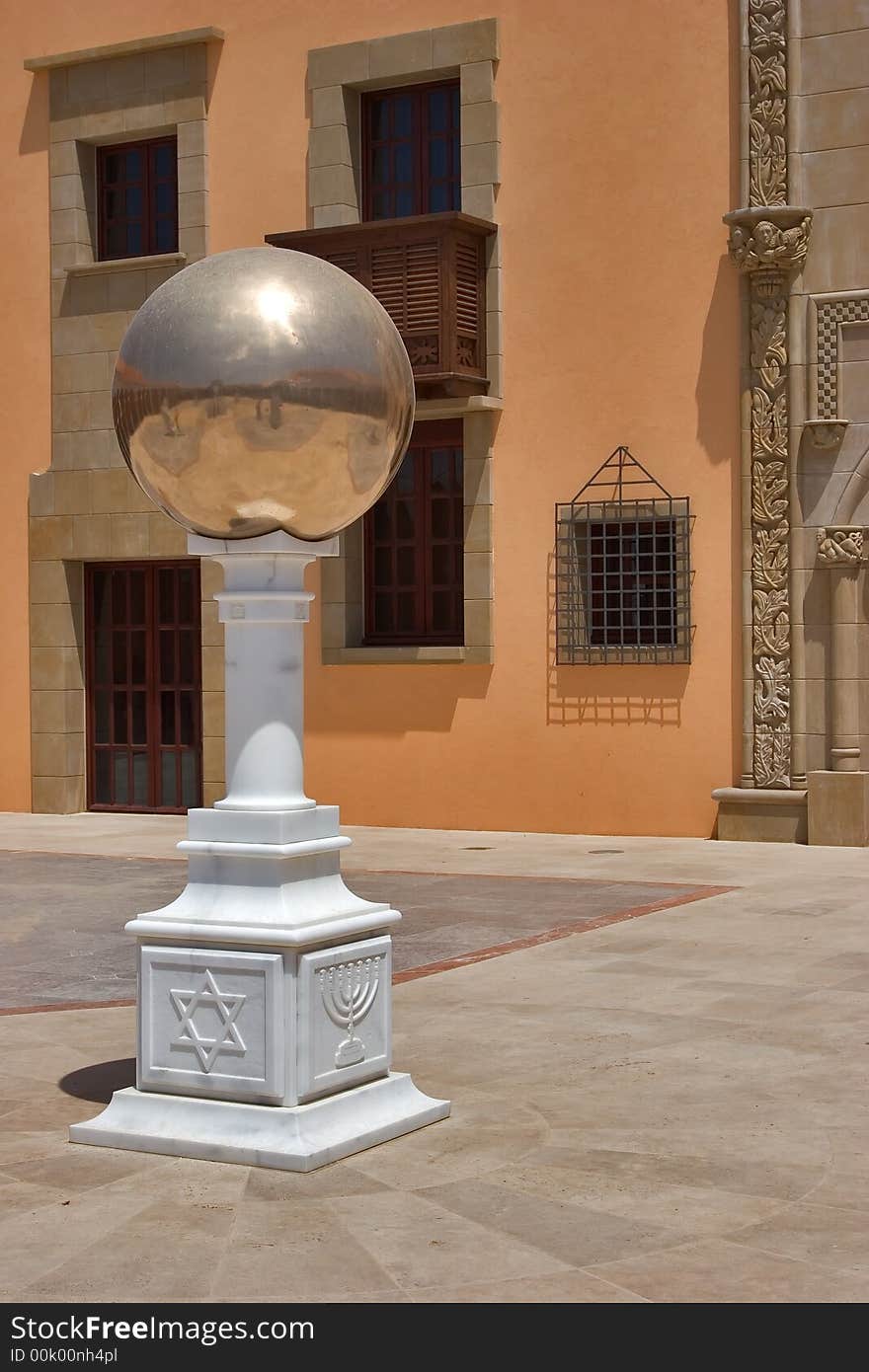 A court yard in the Spanish style and decorated by an allegorical sculpture. A court yard in the Spanish style and decorated by an allegorical sculpture