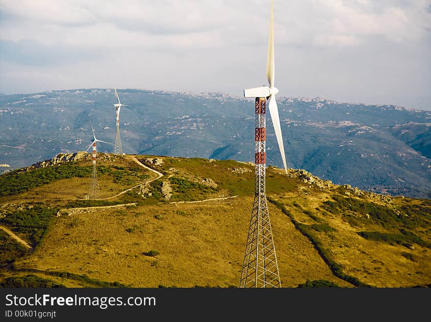 Environmental conservation: wind turbines against the sunset