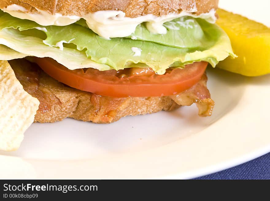 A fresh BLT sandwich with lots of bacon, fresh tomatoes,  lettuce and mayo