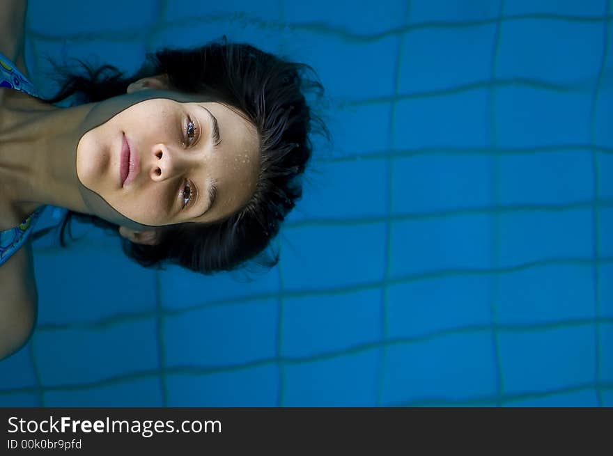 Young girl relaxing in pool