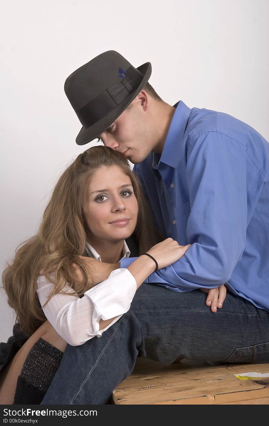 Young couple snuggling together and being romantic. Young couple snuggling together and being romantic