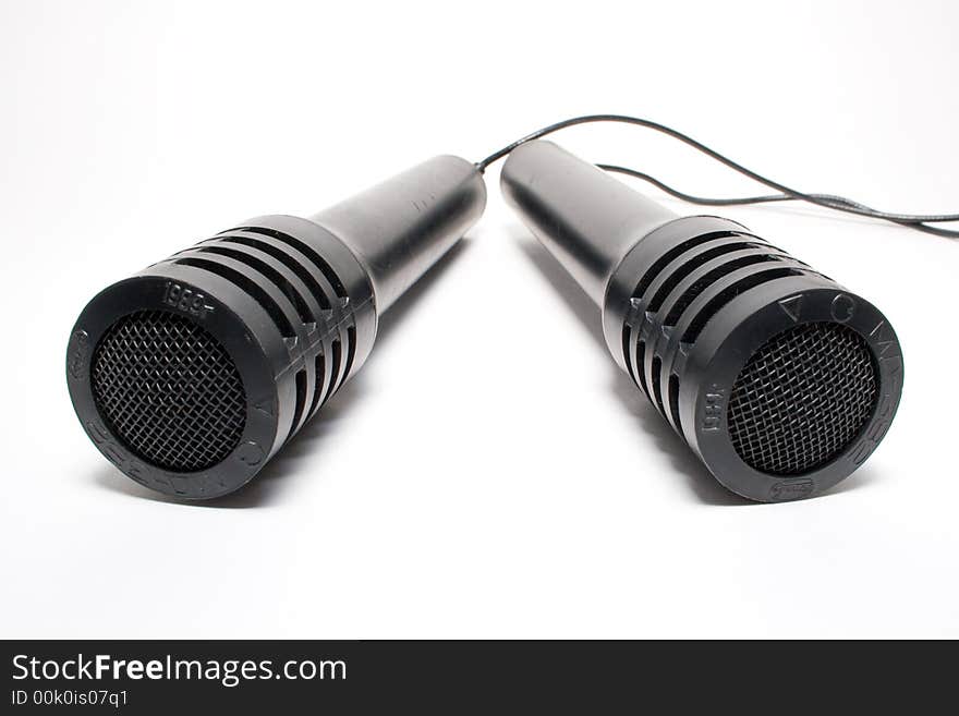 Two old microphones isolated on white