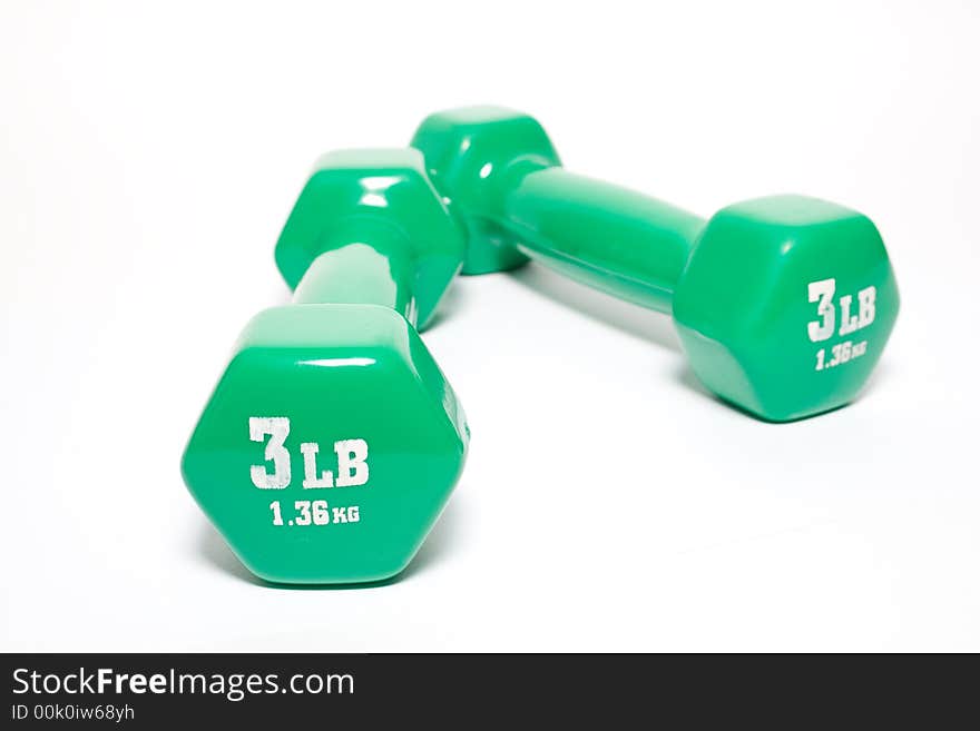 Green dumbbells isolated on white background