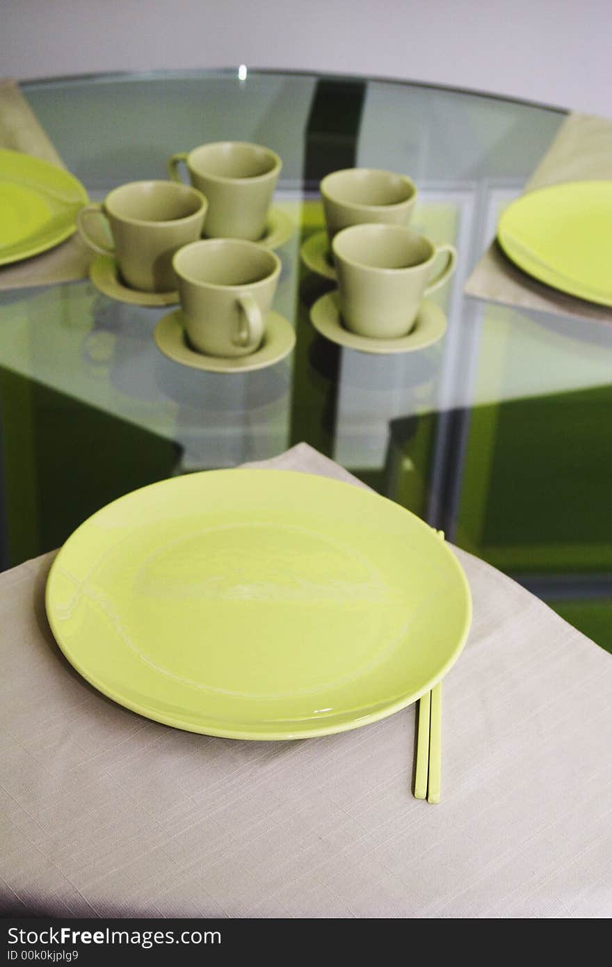 Green dinnerware on round table