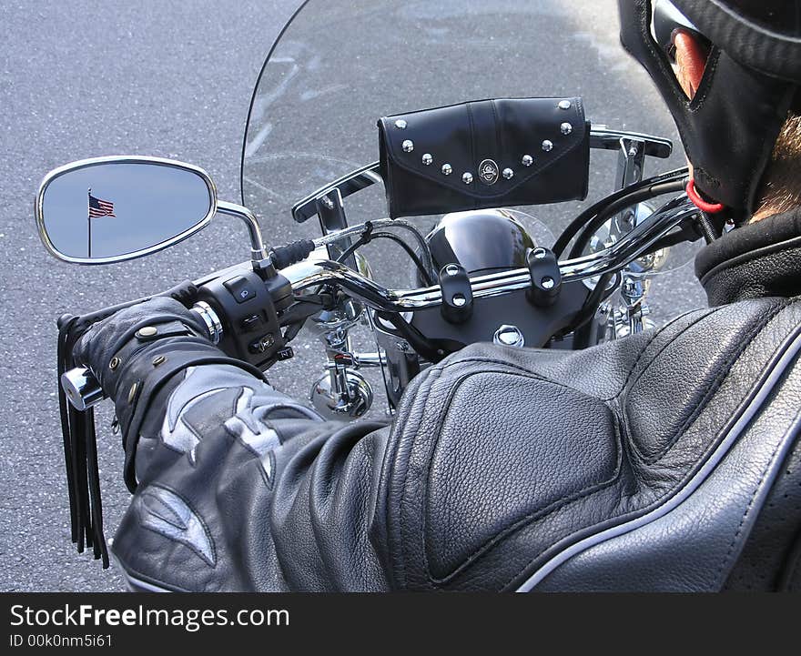 Close up of chrome motor cycle and rider. Close up of chrome motor cycle and rider