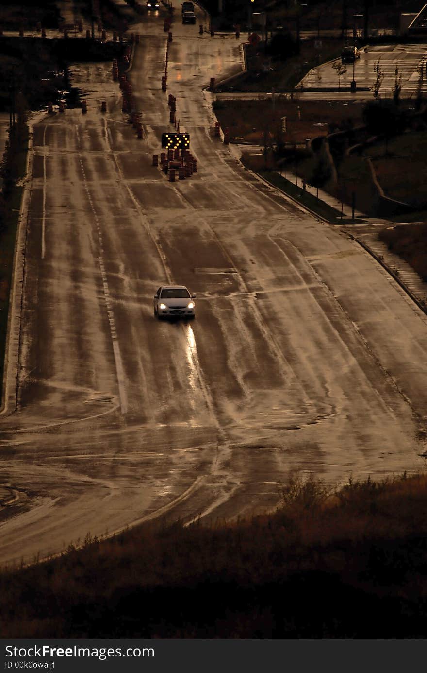 Car with headlights shinning on stormy wet road. Car with headlights shinning on stormy wet road