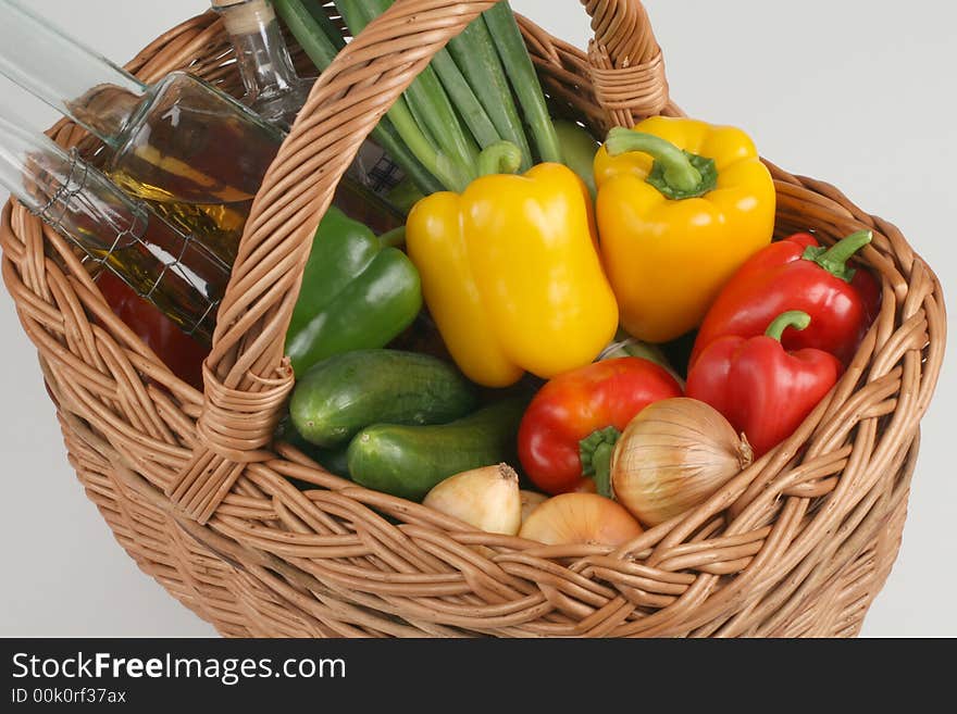 Basket with fresh vegetables and oil. Basket with fresh vegetables and oil