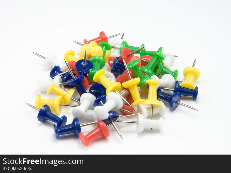 Heap of multicolored paper clips on white background