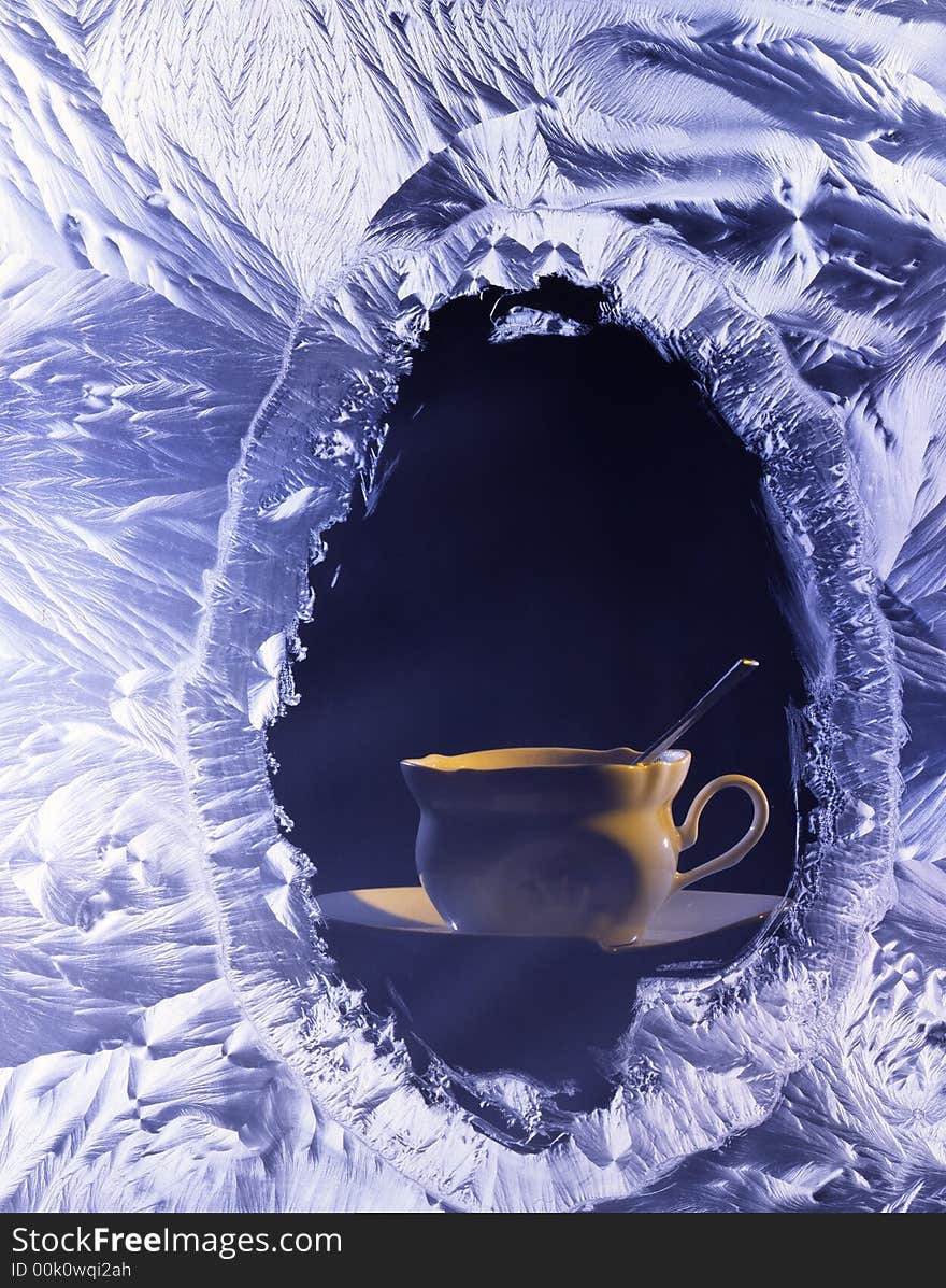 Cup of coffee on a table with the spoon