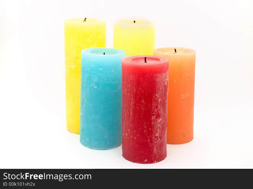 Several colored candles on white