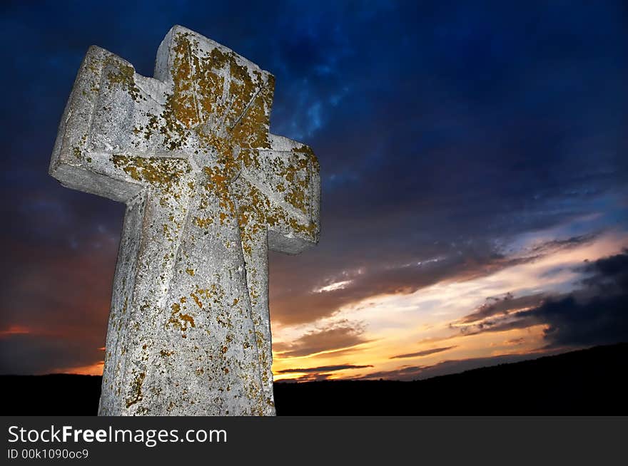 Brightly lit stone cross